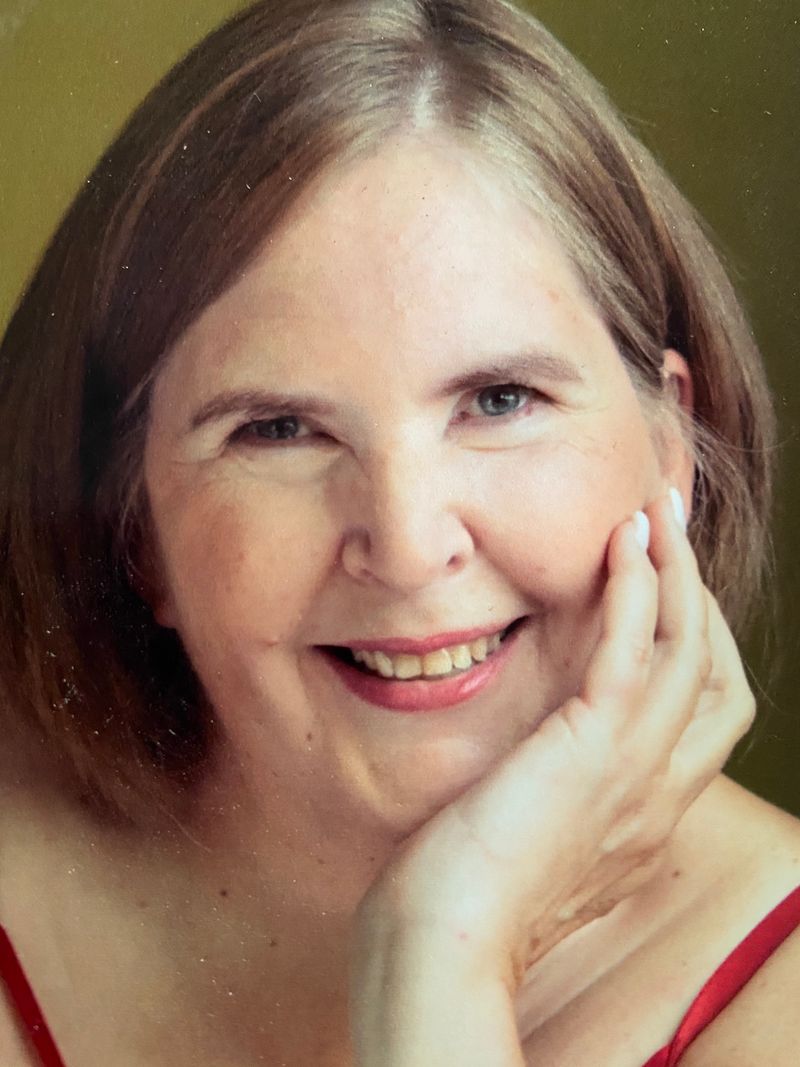 IMG_1652 - Janet Clattenburg woman with hand on chin smiling directly at camera